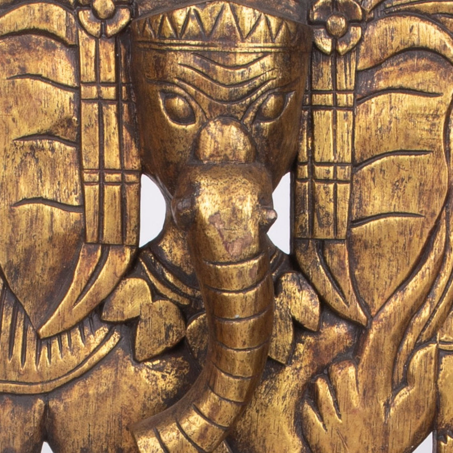Golden Ganesha Standing Tall on the Wall