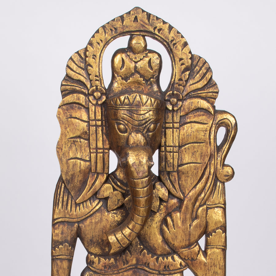 Golden Ganesha Standing Tall on the Wall